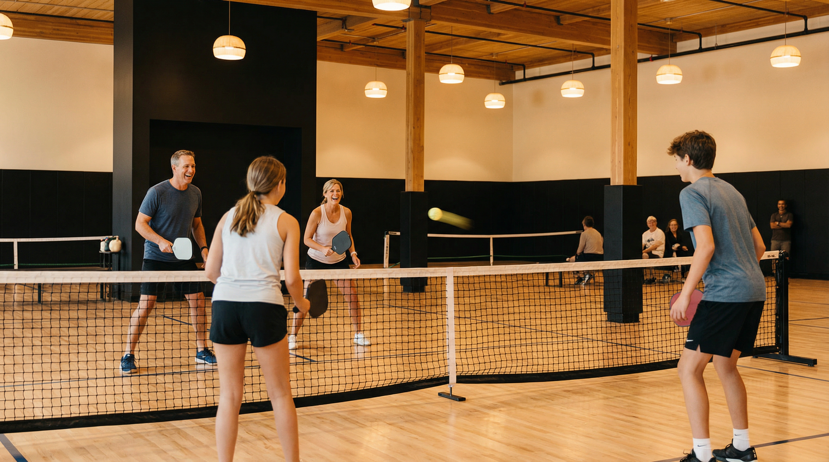Family playing pickleball at The Stack
